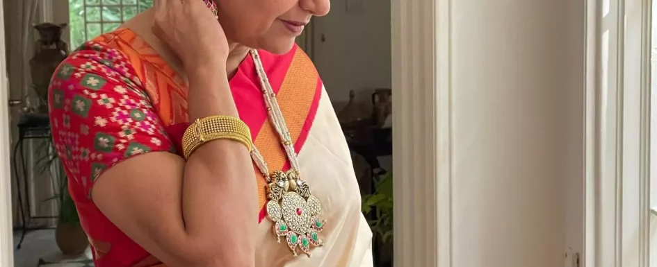 Suhasini in Cream Saree with Red Border